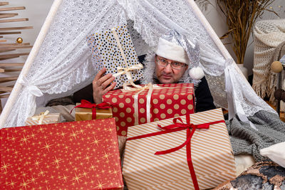 Portrait of man sitting in box