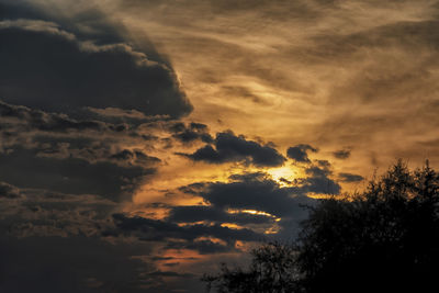 Low angle view of dramatic sky during sunset