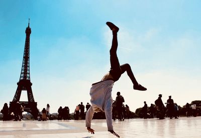 Group of people jumping against the sky