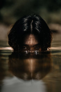 Close-up portrait of a woman with reflection