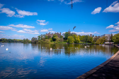 Scenic view of lake against cloudy sky