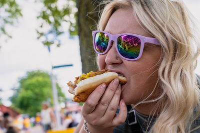 Portrait of woman eating ice cream