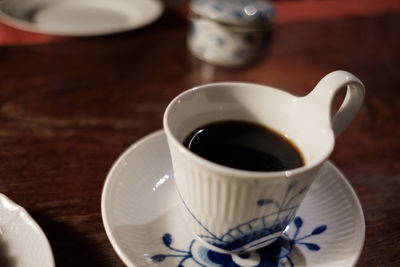 Close-up of coffee cup on table