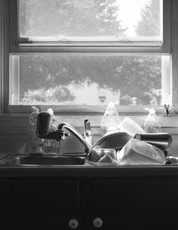 Close-up of man looking through window