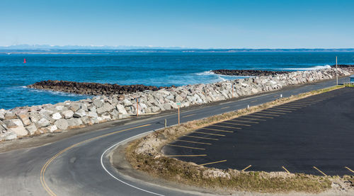 A view of a shoreline road and water in westport, washington..