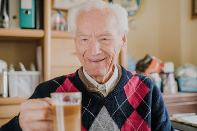 Portrait of smiling man with drink