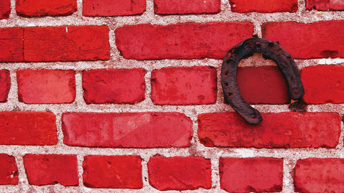 Close-up of red brick wall