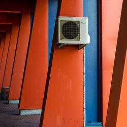 Air conditioner mounted on orange column