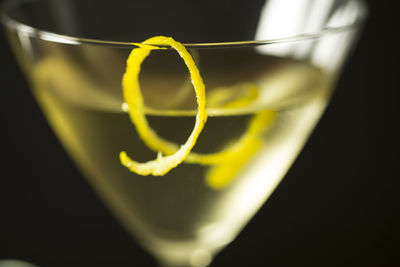 Close-up of beer in glass against black background