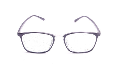 Close-up of eyeglasses against white background