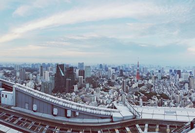 High angle view of modern buildings in city against sky