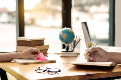 Close-up of business colleagues working in office