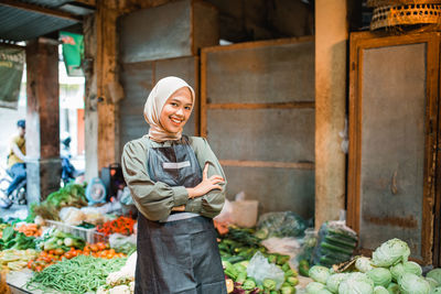 Portrait of woman standing in market