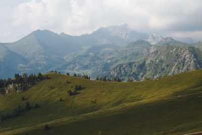 Scenic view of landscape and mountains against sky