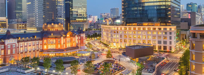 High angle view of illuminated buildings in city at night