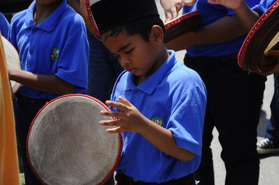 Rear view of father and son playing