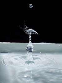 Close-up of splashing water over white background
