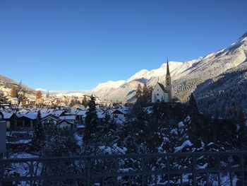 Snowcapped mountains against clear blue sky
