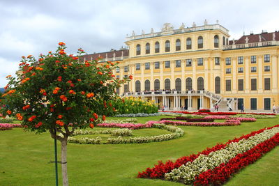 View of formal garden with buildings in background