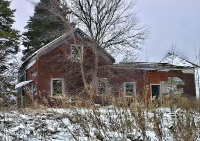 Houses on snow covered landscape