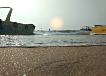 Scenic view of beach against sky during sunset