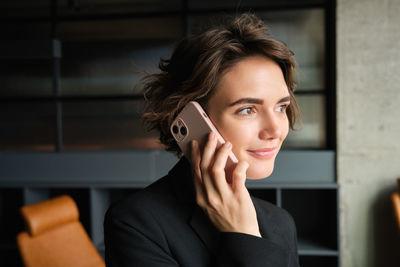 Young woman using mobile phone