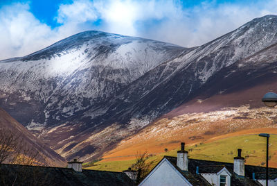 Scenic view of snowcapped mountains against sky