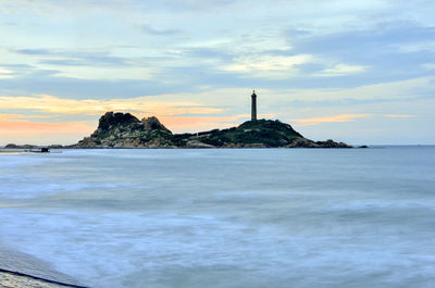 Scenic view of sea against cloudy sky