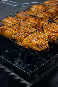 Close-up of meat on barbecue grill