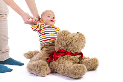 Full length of stuffed toy against white background