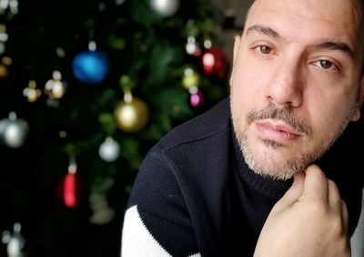 Portrait of man on christmas tree