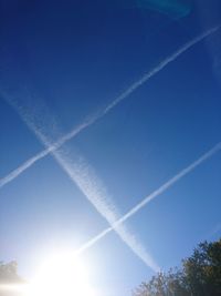 Low angle view of vapor trails in sky