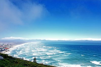 High angle view of sea against blue sky