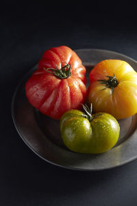 Heirloom tomatoes on pewter plate