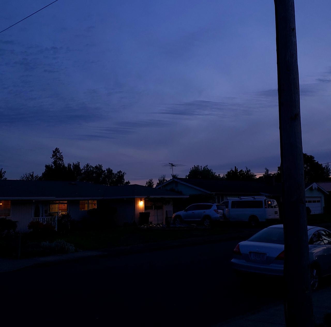 CARS ON STREET AT DUSK