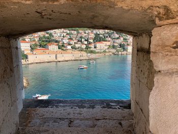 High angle view of sea seen through wall