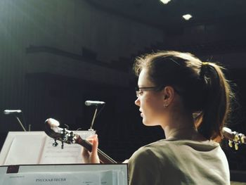 Portrait of young woman looking away