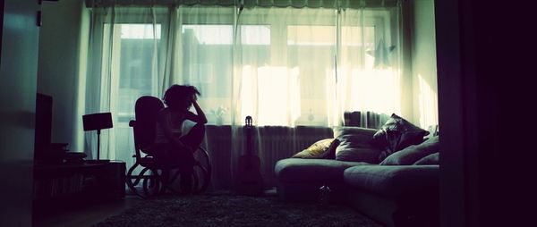 Woman sitting on sofa