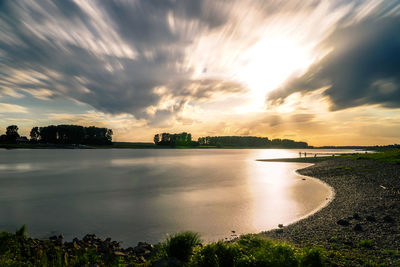 View of lake against cloudy sky
