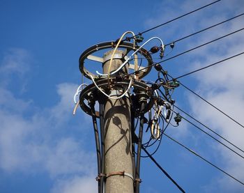 Low angle view of street light against sky