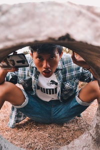 High angle view portrait of boy outdoors