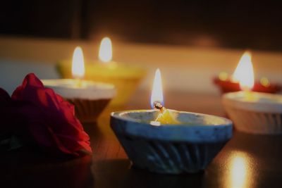 Close-up of illuminated diyas