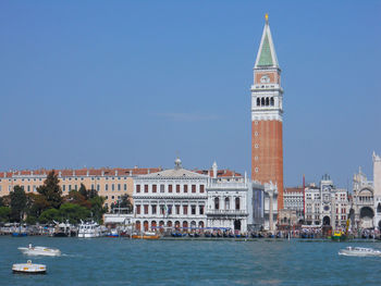 Venice, italy. may 2011. the world famous canals of venice with the campanile di san marco.