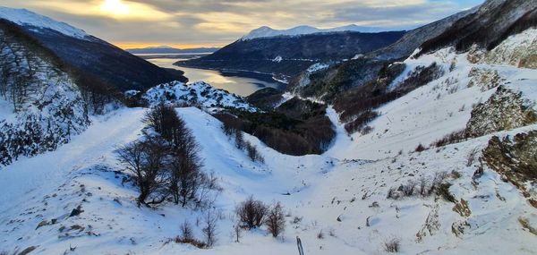 Scenic view of snow covered mountains against sky