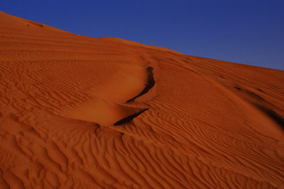 Scenic view of desert against clear sky