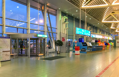 Interior of illuminated shopping mall