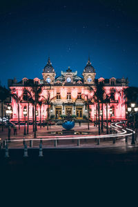 Illuminated buildings in city at night
