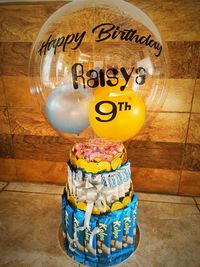 Close-up of birthday cake on table