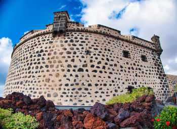 Low angle view of historical building against sky