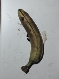 High angle view of bananas on white table